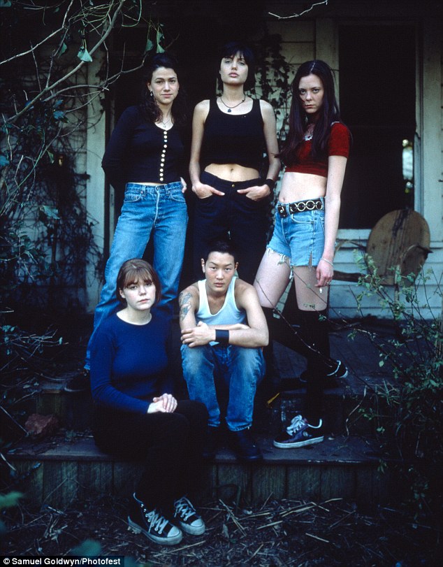 Switching sides: She split from the Brit when the film wrapped, which led her to her first same-sex relationship with model-actress Jenny Shimizu (bottom right), whom she met on the set of 1996