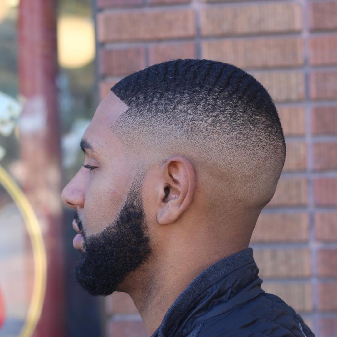 Fade haircut with waves	
